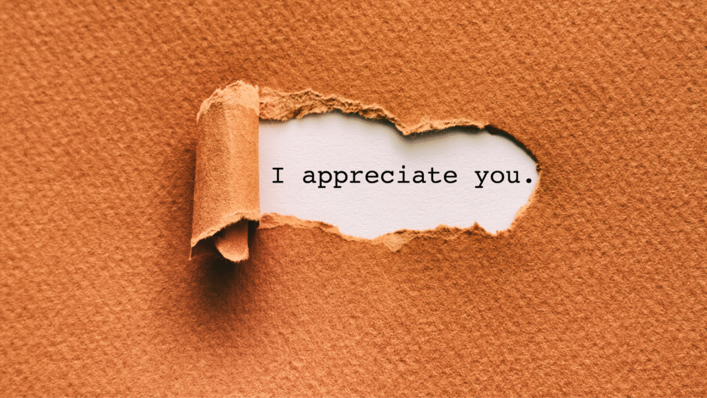 A ripped paper revealing I appreciate you script.